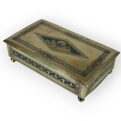 15A - A MID 20TH CENTURY IRAQI/IRANIAN SILVER NIELLO RECTANGULAR CIGARETTE BOX
Raised on four bunn feet, l... 