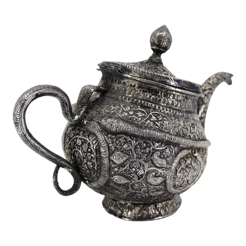 16A - A HEAVY LATE 19TH/EARLY 20TH CENTURY INDIAN RAJ PERIOD KASHMIRI SILVER TEAPOT OF TIPPED KANG FORM
Ch... 