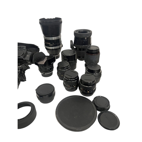 69A - A LARGE COLLECTION OF PENTAX CAMERA, LENSES AND STANDARDS.