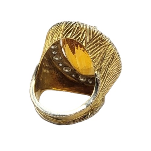 35 - LARGE VINTAGE 18CT GOLD, CITRINE AND DIAMOND COCKTAIL RING
The central oval cut Citrine (approx. 20m... 