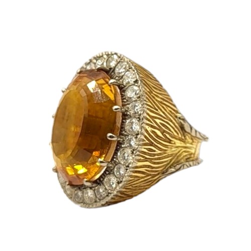 35 - LARGE VINTAGE 18CT GOLD, CITRINE AND DIAMOND COCKTAIL RING
The central oval cut Citrine (approx. 20m... 