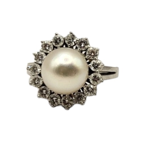 42 - AN 18CT WHITE GOLD, PEARL AND DIAMOND CLUSTER RING
Central pearl (approx. 9mm) surrounded by fifteen... 