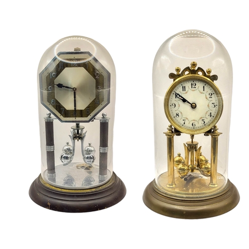 56A - TWO 20TH CENTURY ANNIVERSARY METAL CLOCKS 
One being Art Deco style, underneath glass domes. 
(large... 