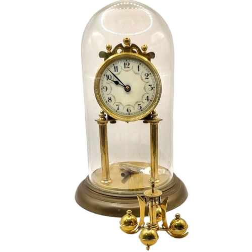 56A - TWO 20TH CENTURY ANNIVERSARY METAL CLOCKS 
One being Art Deco style, underneath glass domes. 
(large... 