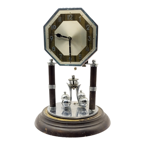 56A - TWO 20TH CENTURY ANNIVERSARY METAL CLOCKS 
One being Art Deco style, underneath glass domes. 
(large... 