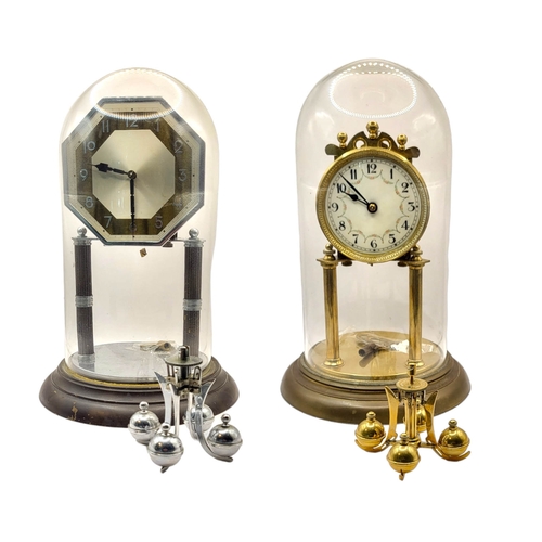 56A - TWO 20TH CENTURY ANNIVERSARY METAL CLOCKS 
One being Art Deco style, underneath glass domes. 
(large... 