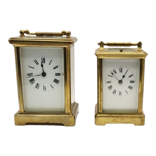 59A - TWO EARLY 20TH CENTURY GILT METAL CARRIAGE CLOCKS
Both having white enamelled dial with Roman numera... 