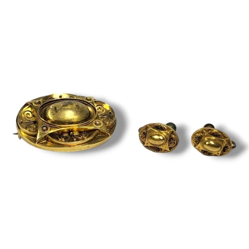 29A - A VICTORIAN 15CT GOLD AND ETRUSCAN REVIVAL OVAL BROOCH AND EARRINGS
Having applied wire decoration, ... 