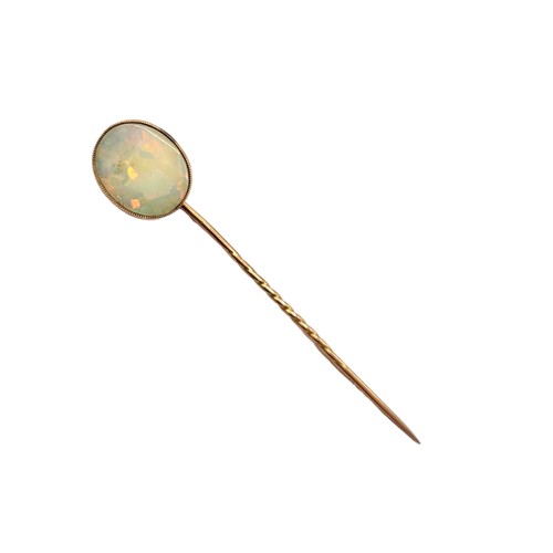 6A - A LATE VICTORIAN/ EARLY EDWARDIAN YELLOW METAL AND OPAL STICK PIN, YELLOW METAL TESTED AS 9CT GOLD
O... 