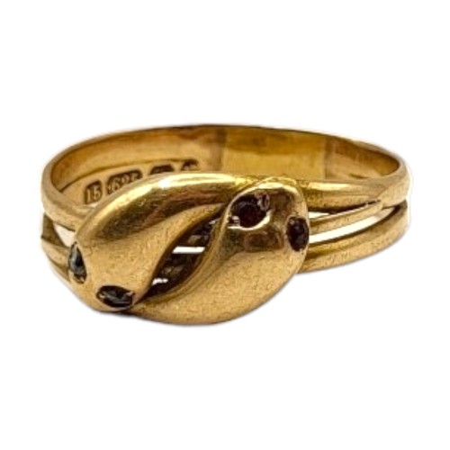 3A - A VICTORIAN 15CT GOLD, DIAMOND AND RED SPINEL ENTWINED SNAKE RING
Two snake heads with diamond and r... 