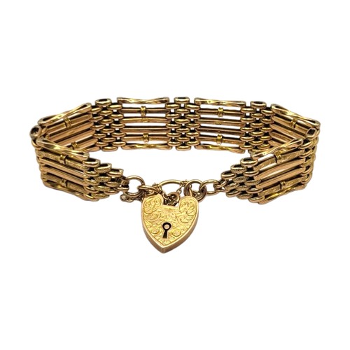 4A - AN EDWARDIAN 9CT GOLD GATE LINK BRACELET
Having chased and engraved heart padlock clasp, links havin... 