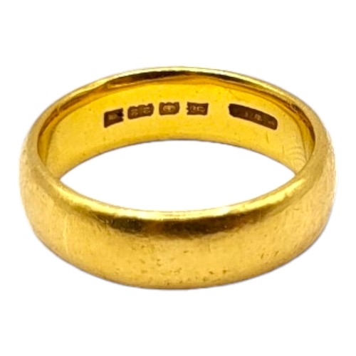 32A - A 22CT YELLOW GOLD BAND RING.
(UK ring size S, 11.2g)