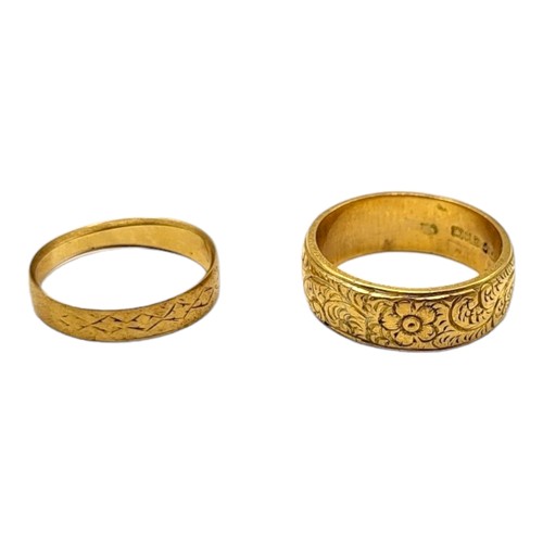 39A - AN EDWARDIAN 18CT GOLD BAND RING, TOGETHER WITH A 1910’S 18CT GOLD AND FLORAL CHASED BAND RING. 
(UK... 