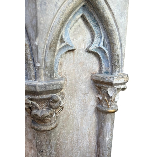 203 - A PAIR OF 16TH CENTURY OCTAGONAL CARVED LIMESTONE COLUMNSEach with eight Gothic-arched niches, decor... 