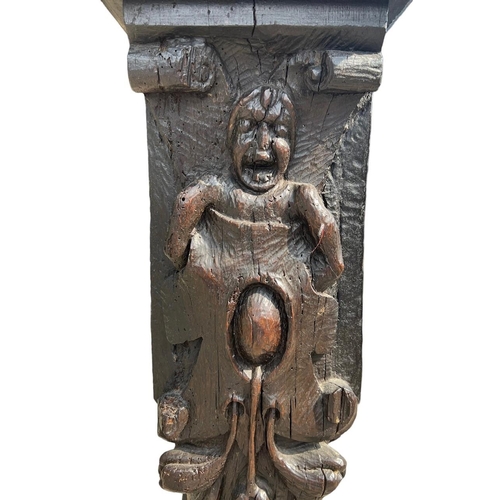 205 - A RARE 16TH CENTURY CARVED OAK COLUMNDecorated with with a grotesque facial figure above Satyress, e... 