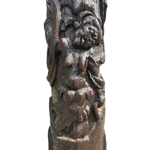 205 - A RARE 16TH CENTURY CARVED OAK COLUMNDecorated with with a grotesque facial figure above Satyress, e... 