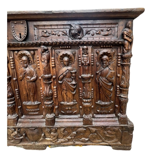 207 - A 16TH CENTURY FRENCH, OAK COFFER with hinged lid above carved freeze decorated with swags and mount... 