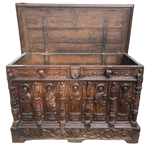 207 - A 16TH CENTURY FRENCH, OAK COFFER with hinged lid above carved freeze decorated with swags and mount... 