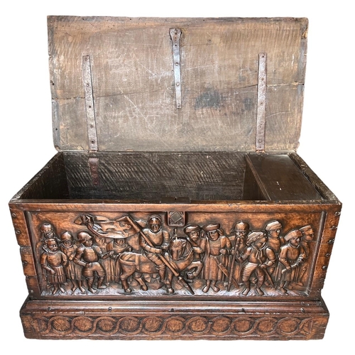 211 - A RARE 15TH CENTURY FRENCH CARVED WALNUT COFFER,With hinge lid above carved panel in relief with a k... 