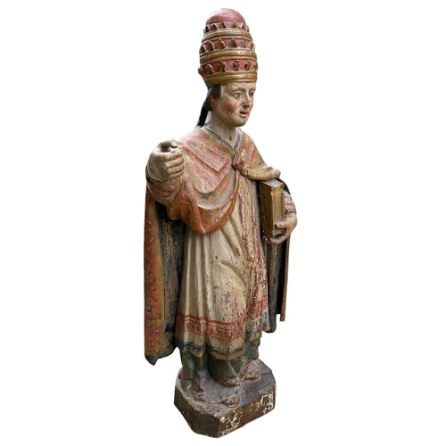 215 - A LARGE 16TH/17TH CENTURY CARVED WOOD POLYCHROME AND GILDED STATUE OF A POPEWearing the triple tiara... 