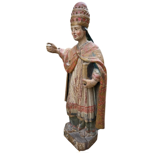 215 - A LARGE 16TH/17TH CENTURY CARVED WOOD POLYCHROME AND GILDED STATUE OF A POPEWearing the triple tiara... 