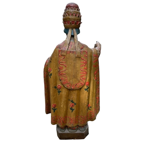 215 - A LARGE 16TH/17TH CENTURY CARVED WOOD POLYCHROME AND GILDED STATUE OF A POPEWearing the triple tiara... 