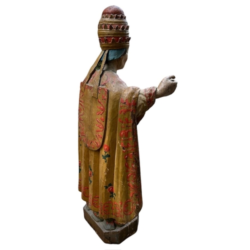 215 - A LARGE 16TH/17TH CENTURY CARVED WOOD POLYCHROME AND GILDED STATUE OF A POPEWearing the triple tiara... 