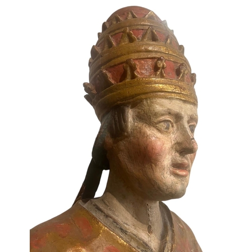 215 - A LARGE 16TH/17TH CENTURY CARVED WOOD POLYCHROME AND GILDED STATUE OF A POPEWearing the triple tiara... 