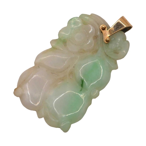 11 - A CHINESE CARVED JADE AND YELLOW METAL PENDANT (YELLOW METAL TESTED AS 14CT YELLOW GOLD)
Carving sho... 