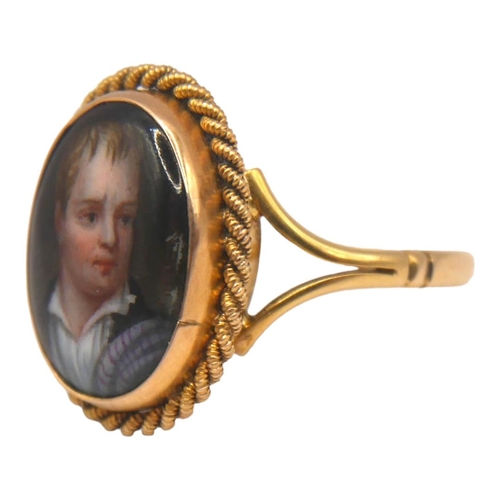 13 - A VICTORIAN YELLOW METAL AND PORCELAIN PORTRAIT RING (YELLOW METAL TESTS AS 18CT YELLOW GOLD)
Oval b... 