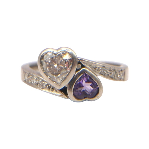 21 - A VINTAGE PLATINUM, DIAMOND AND AMETHYST HEART FORM RING
Bezel set Heart cut diamond and amethyst (d... 