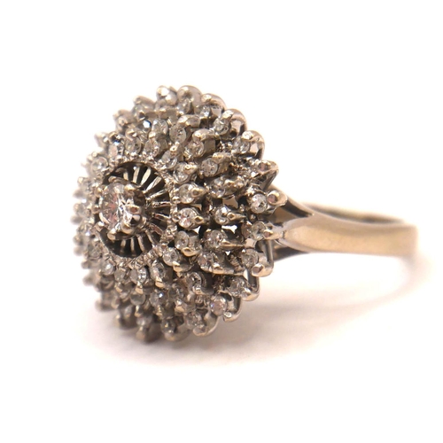 27 - A VINTAGE 18CT WHITE GOLD AND DIAMOND CLUSTER RING
Three tiered round cut diamond halo (approx diame... 