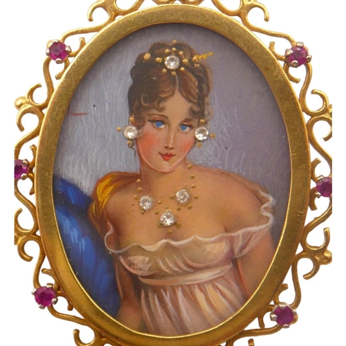 28 - A VINTAGE 18CT GOLD AND RUBY OVAL BROOCH/PENDANT
Portrait of lady under glass, mounted in scrolling ... 