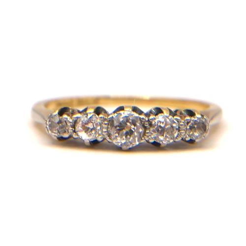 31 - A VINTAGE 18CT YELLOW GOLD AND PLATINUM FIVE STONE DIAMOND RING
The graduated row of old European cu... 