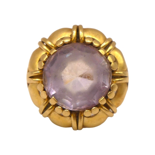 47 - A VINTAGE 14CT YELLOW GOLD AND AMETHYST RING
The central round cut amethyst (approx diameter 12mm) f... 