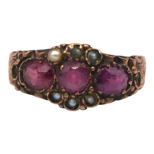 6 - A VICTORIAN 9CT ROSE GOLD, AMETHYST AND SEED PEARL RING
The central round cut amethyst (approx diame... 