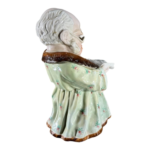 102 - CONTA AND BOEHME, A 19TH CENTURY GERMAN PORCELAIN NOVELTY TOBACCO JAR, CIRCA 1880’SShowing a seated ... 