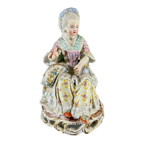 104 - MEISSEN, AN 18TH CENTURY GERMAN PORCELAIN FIGURE, TITLED ‘GIRL WITH YARN’, MODELLED BY MICHEL VICTOR... 