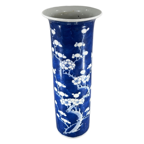 117 - A 19TH CENTURY CHINESE QING DYNASTY BLUE AND WHITE TRUMPET VASEDecorated with prunus blossom on blue... 