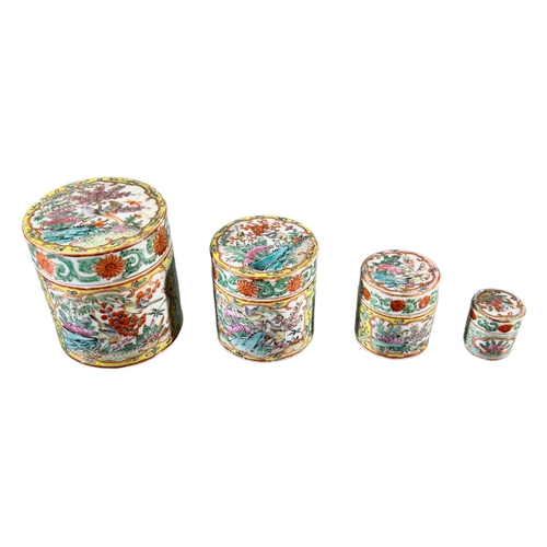 135 - COLLECTION OF FOUR 19TH CENTURY CHINESE FAMILLE JAUNE CYLINDRICAL JARS AND COVERSEach decorated exte... 