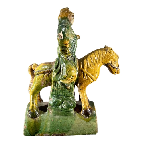 140 - A 19TH CENTURY CHINESE QING DYNASTY SANCAI GLAZED EQUESTRIAN ROOF TILEShowing a man on horseback in ... 