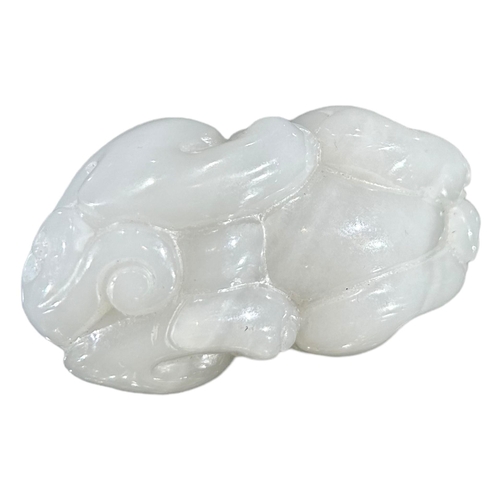 168 - A CHINESE WHITE JADE CARVING OF A MYTHICAL QILINRecumbent position. (h 4cm x w 6.9cm x d 3.6cm)