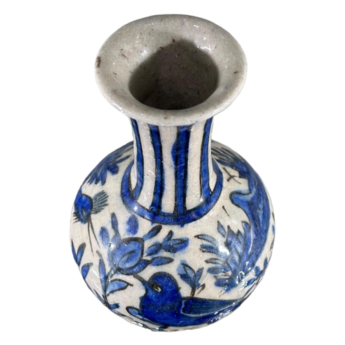 174 - SAFAVID, PERSIA, A LATE 17TH CENTURY / EARLY 18TH CENTURY BLUE AND WHITE BOTTLE VASEDecorated with b... 