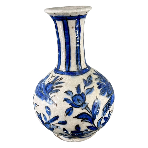 174 - SAFAVID, PERSIA, A LATE 17TH CENTURY / EARLY 18TH CENTURY BLUE AND WHITE BOTTLE VASEDecorated with b... 