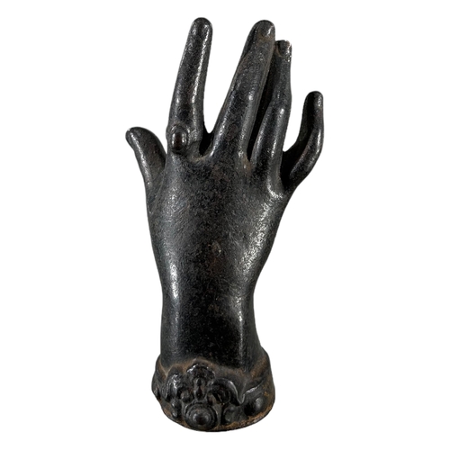 181 - AN EARLY 19TH CENTURY CAST IRON SCULPTURE OF A WOMAN’S HAND. (h 12.2cm x w 6.5cm x d 5.5cm)