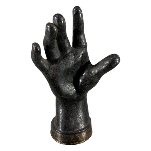 181 - AN EARLY 19TH CENTURY CAST IRON SCULPTURE OF A WOMAN’S HAND. (h 12.2cm x w 6.5cm x d 5.5cm)