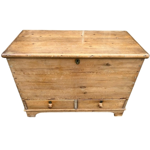 242 - A 19TH CENTURY STRIP AND WAXED PINE MULE CHESTWith hinged lid above two drawers, raised on bracket f... 