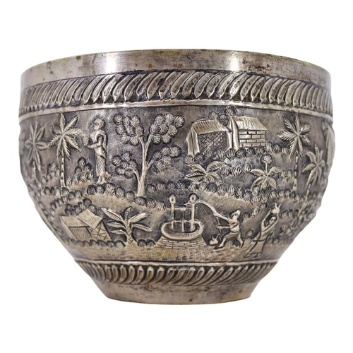 64 - PROBABLY CALCUTTA, INDIA. LATE 19TH/EARLY 20TH CENTURY INDIAN SILVER BOWL. Decorated with village la... 