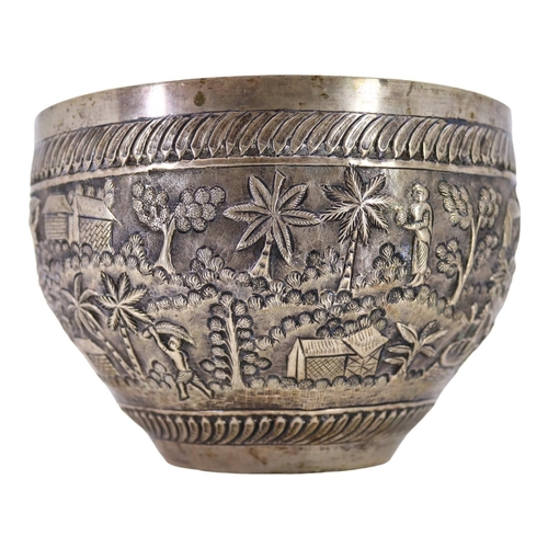 64 - PROBABLY CALCUTTA, INDIA. LATE 19TH/EARLY 20TH CENTURY INDIAN SILVER BOWL. Decorated with village la... 