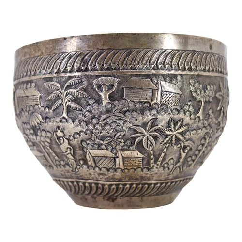 64 - PROBABLY CALCUTTA, INDIA. LATE 19TH/EARLY 20TH CENTURY INDIAN SILVER BOWL. Decorated with village la... 